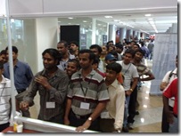Attendees lining up to play the Community dart game at TechEd India